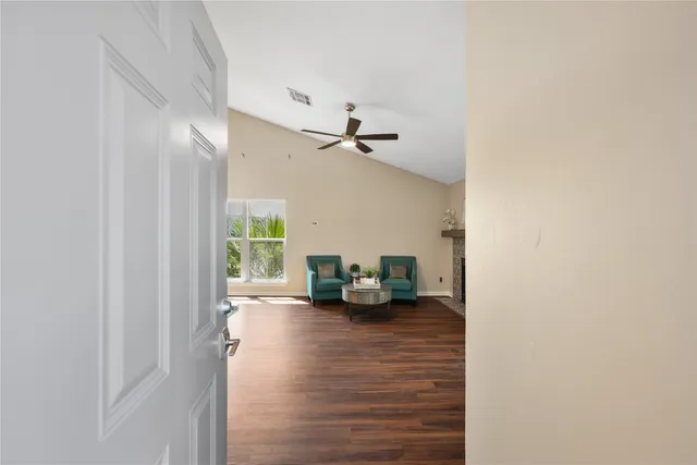 a view of living room with furniture and a window