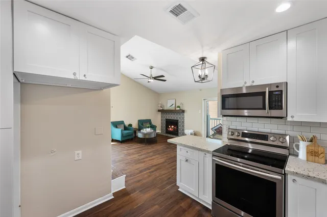 a kitchen with a stove and a microwave