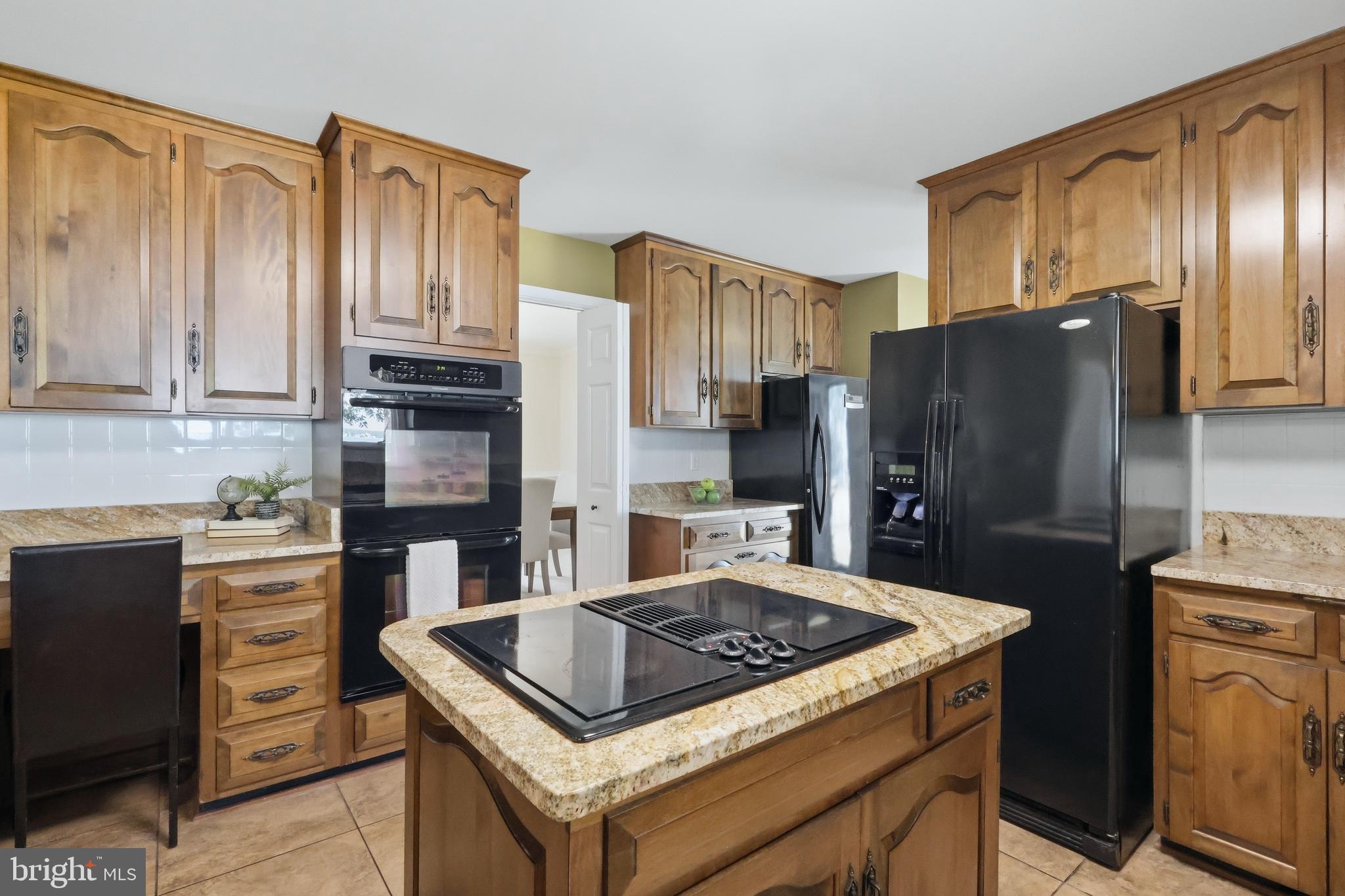 23500 River Road Lexington Park, MD 20653 - Photo 21 of 92 a kitchen with stainless steel appliances granite countertop a stove refrigerator and cabinets