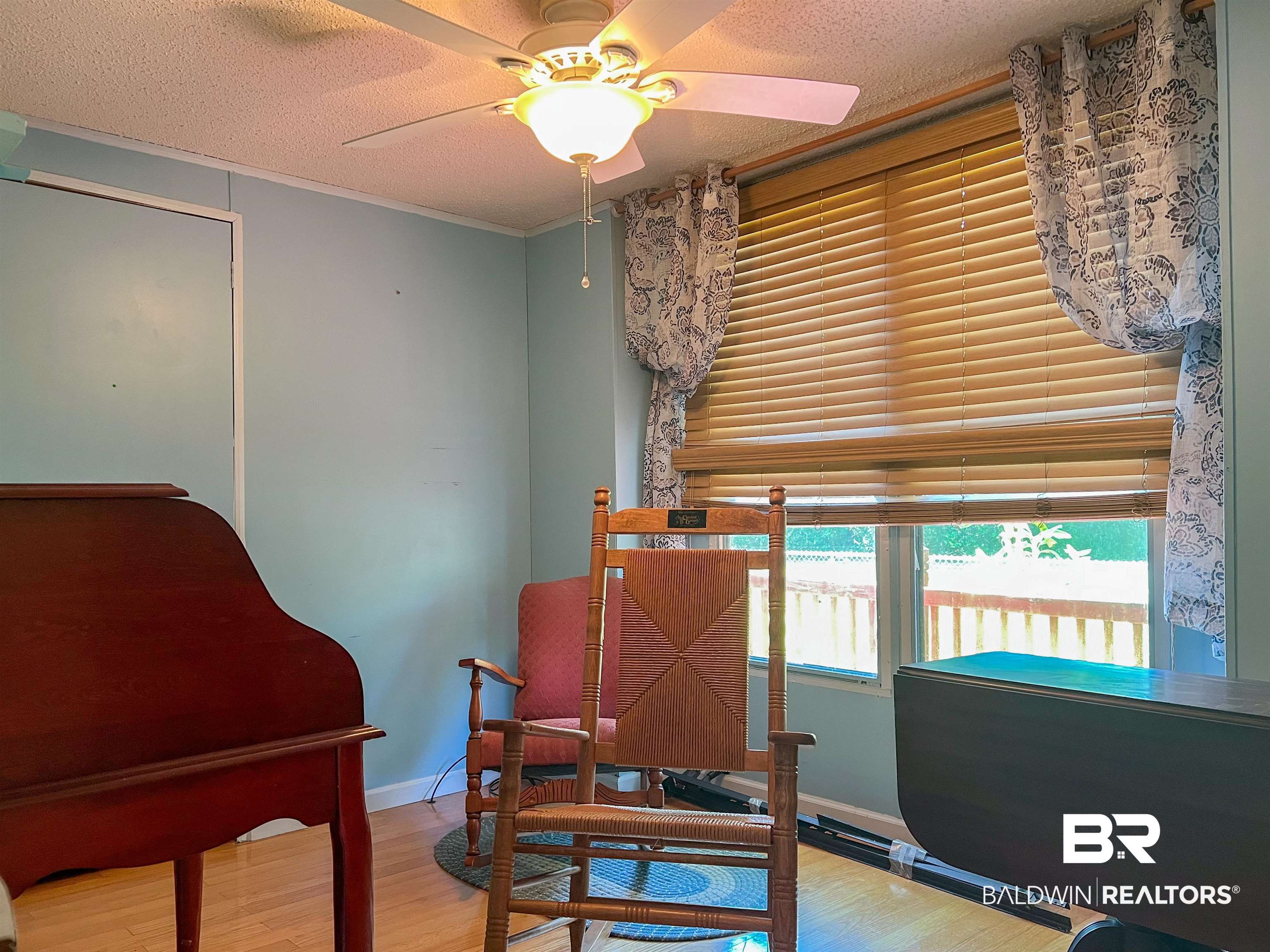 9190 County Road 97 Elberta, AL 36530 - Photo 22 of 53 Sitting room featuring ornamental molding, a textured ceiling, ceiling fan, and hardwood / wood-style floors