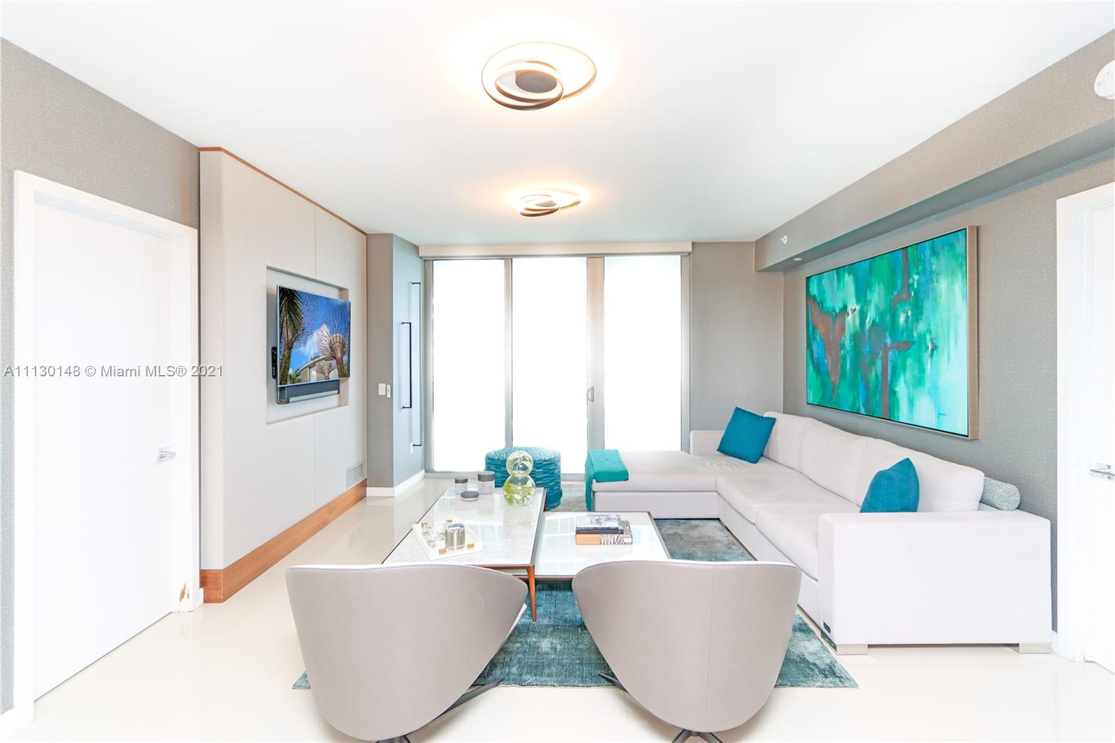 Edgewater Miami, FL 33132 - Photo 3 of 13 a living room with furniture and a large window