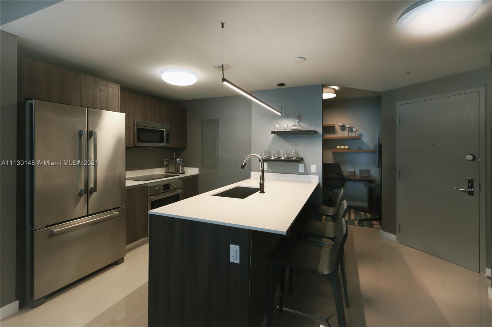 Edgewater Miami, FL 33132 - Photo 4 of 13 a kitchen with stainless steel appliances a refrigerator and a sink