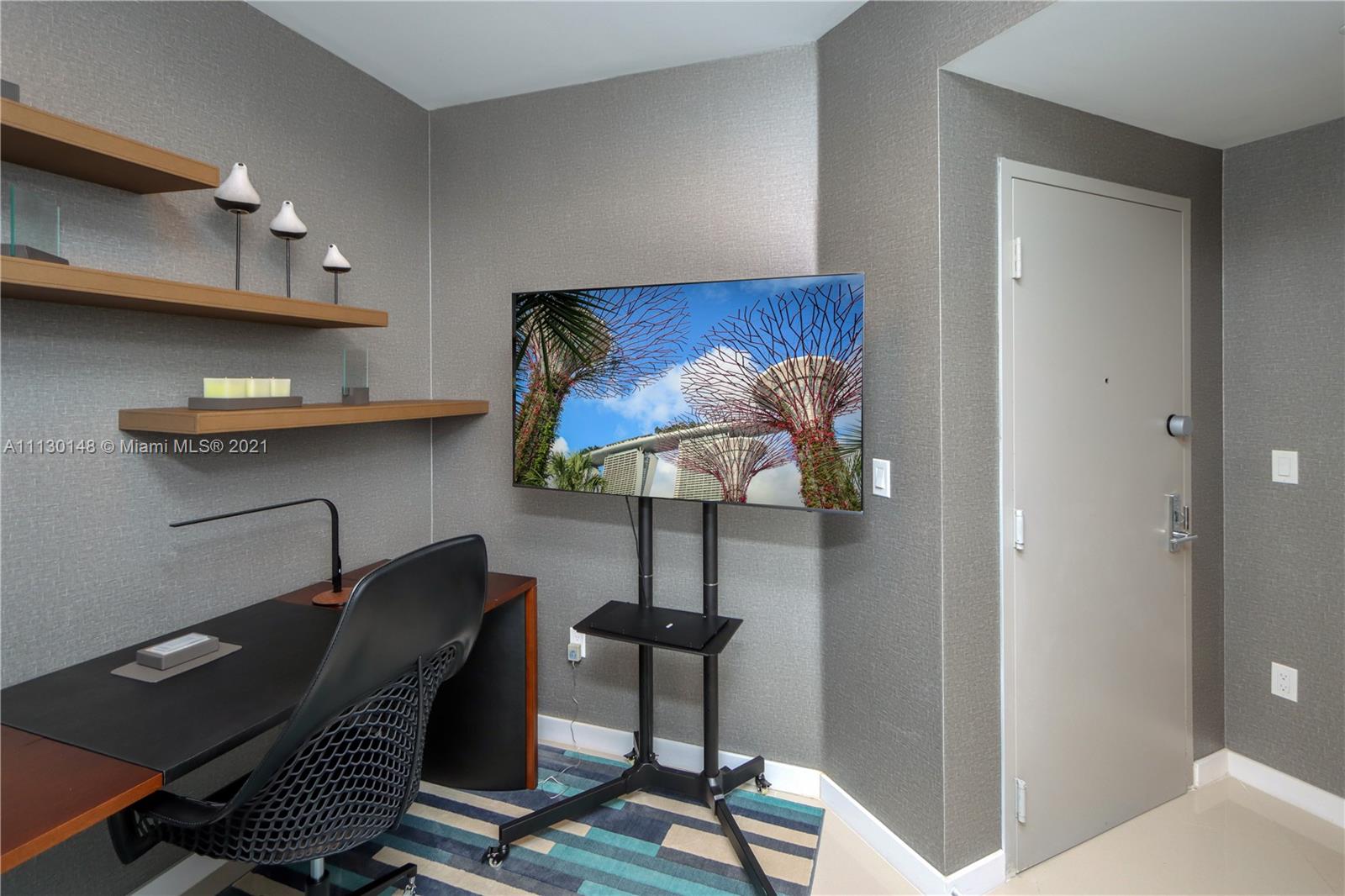 Edgewater Miami, FL 33132 - Photo 7 of 13 a view of a workspace with furniture