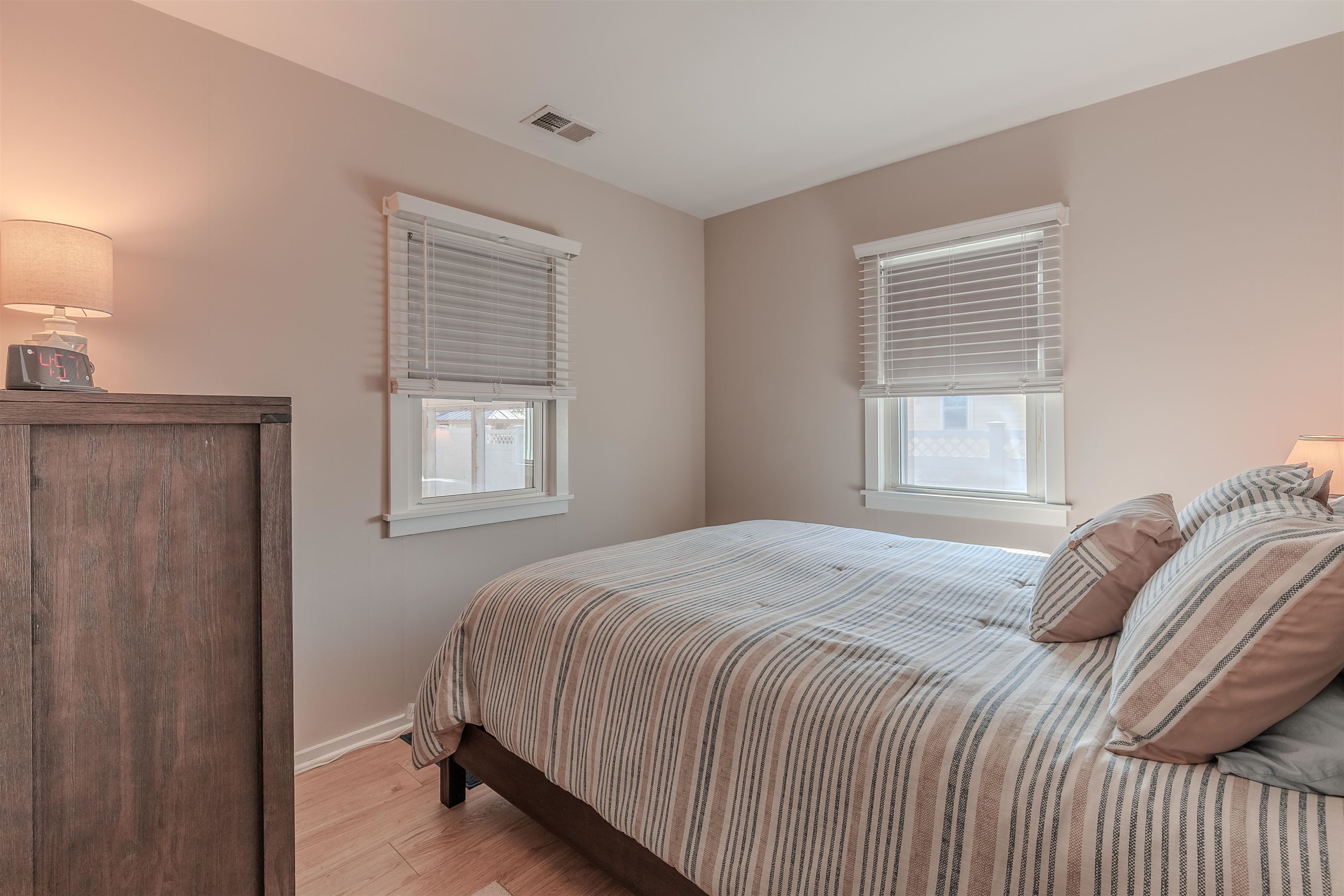 34 Holiday Road Villas, NJ 08251 - Photo 13 of 44 a bedroom with a bed and a window