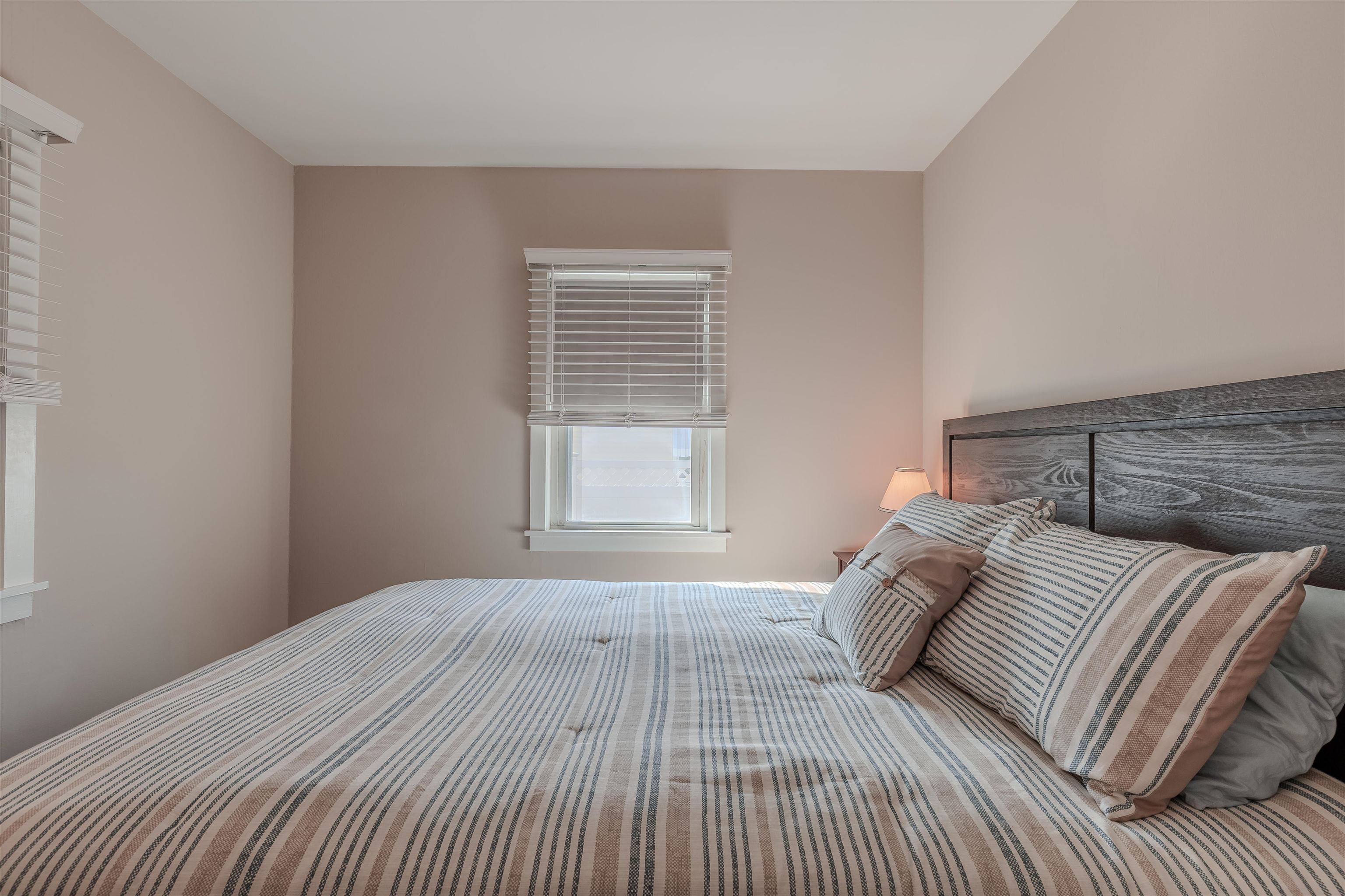 34 Holiday Road Villas, NJ 08251 - Photo 15 of 44 a bedroom with a bed and a window