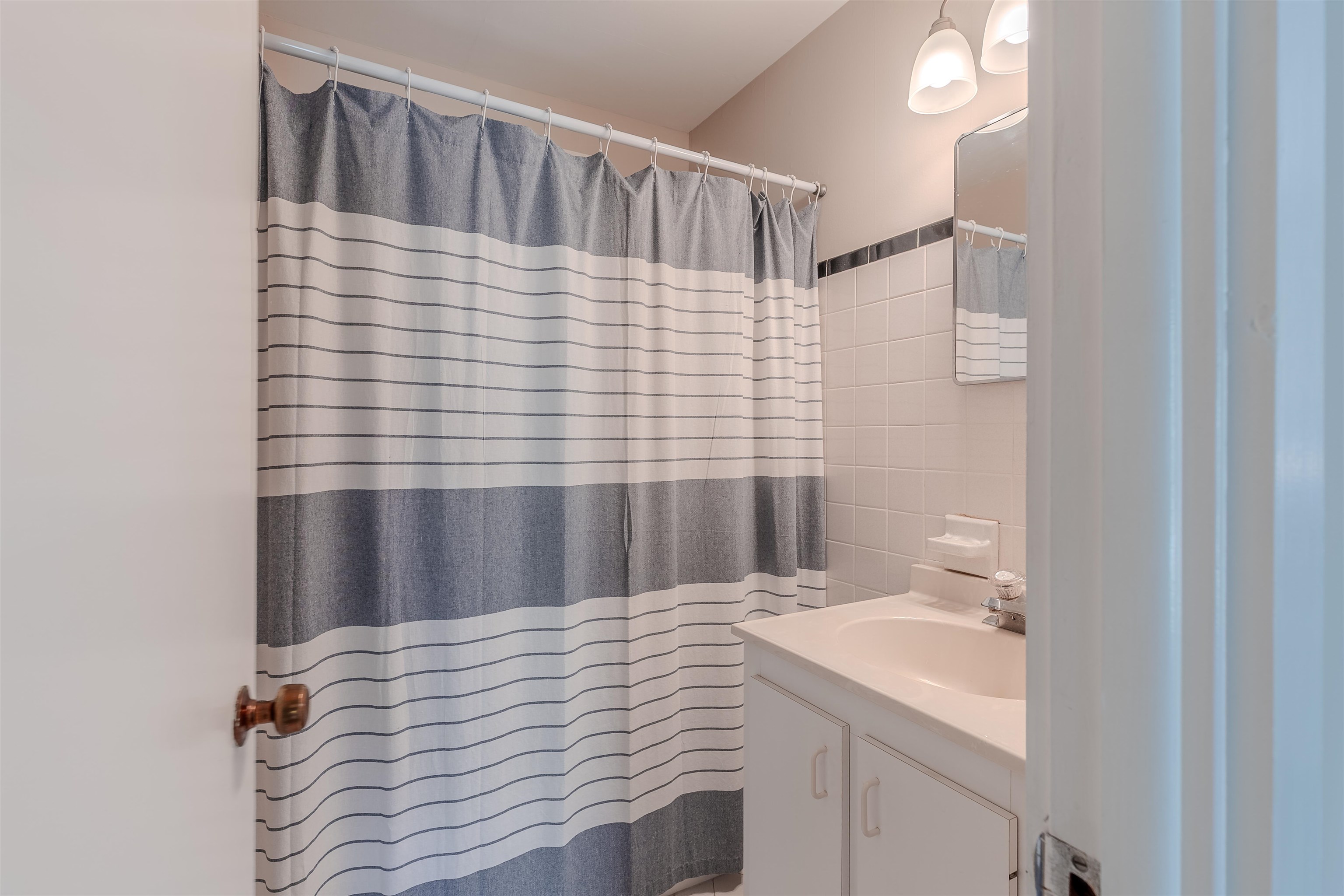 34 Holiday Road Villas, NJ 08251 - Photo 17 of 44 a bathroom with a sink and a mirror