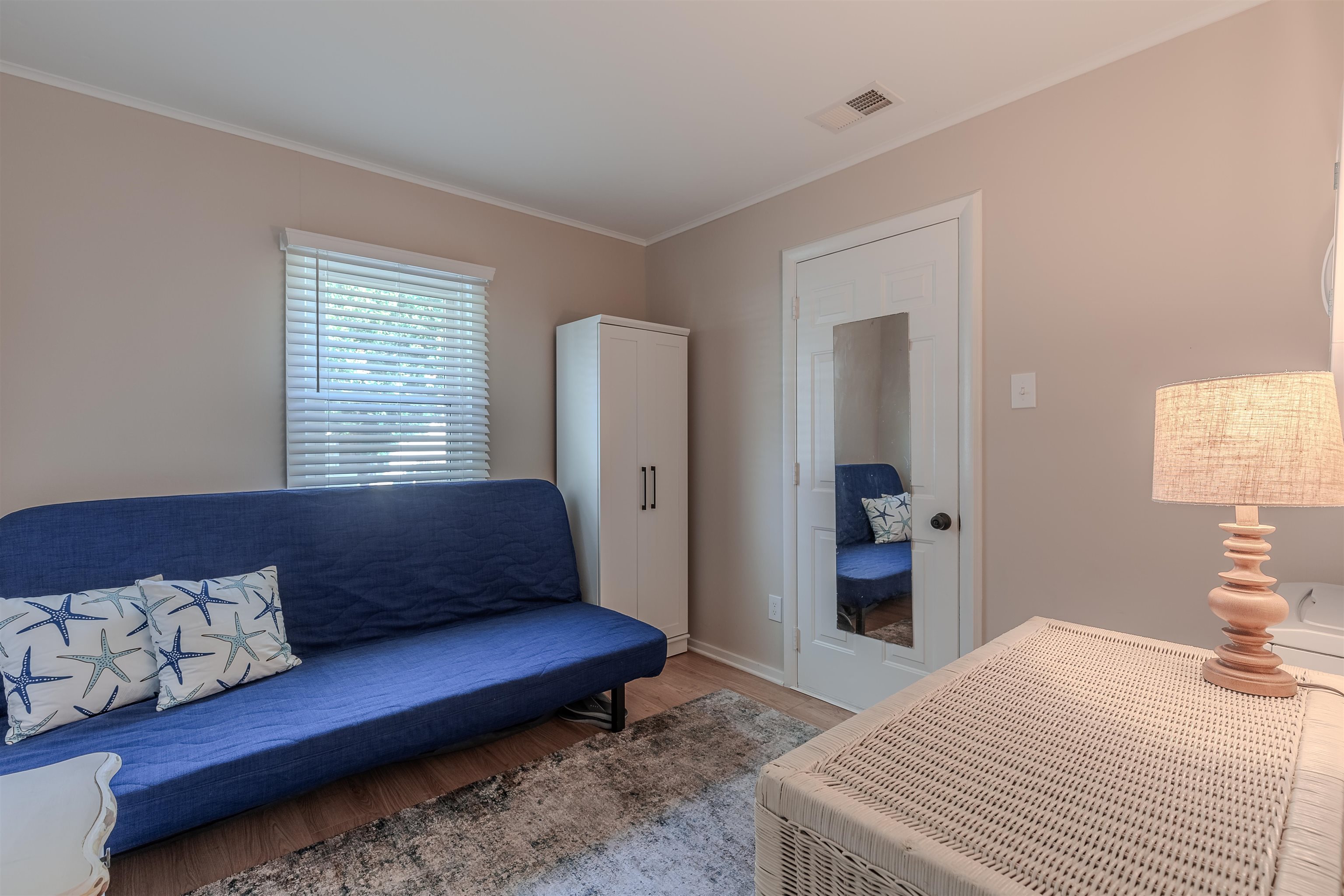 34 Holiday Road Villas, NJ 08251 - Photo 19 of 44 a bedroom with a bed and wooden floor