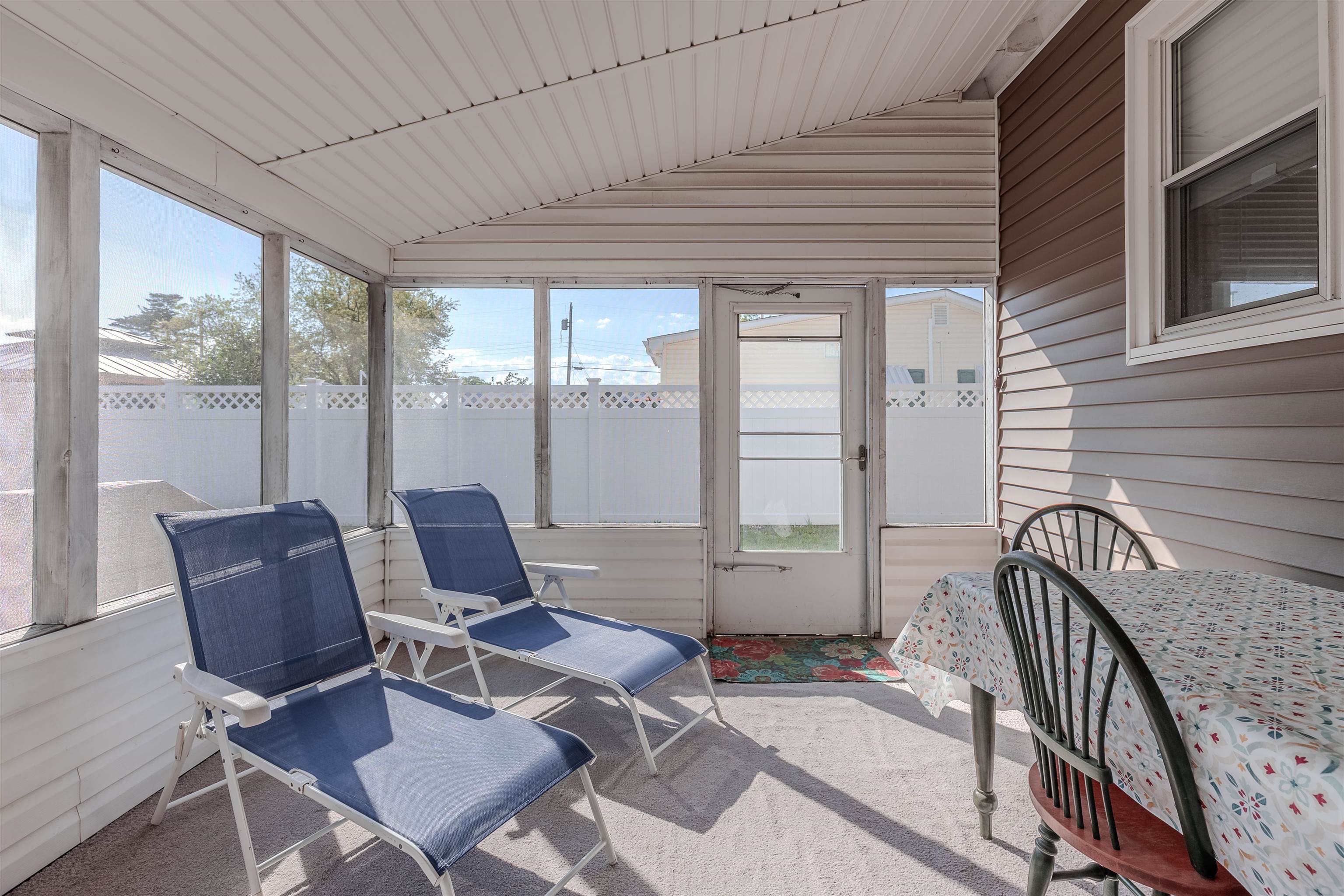 34 Holiday Road Villas, NJ 08251 - Photo 28 of 44 a patio with couple of furniture and outdoor seating