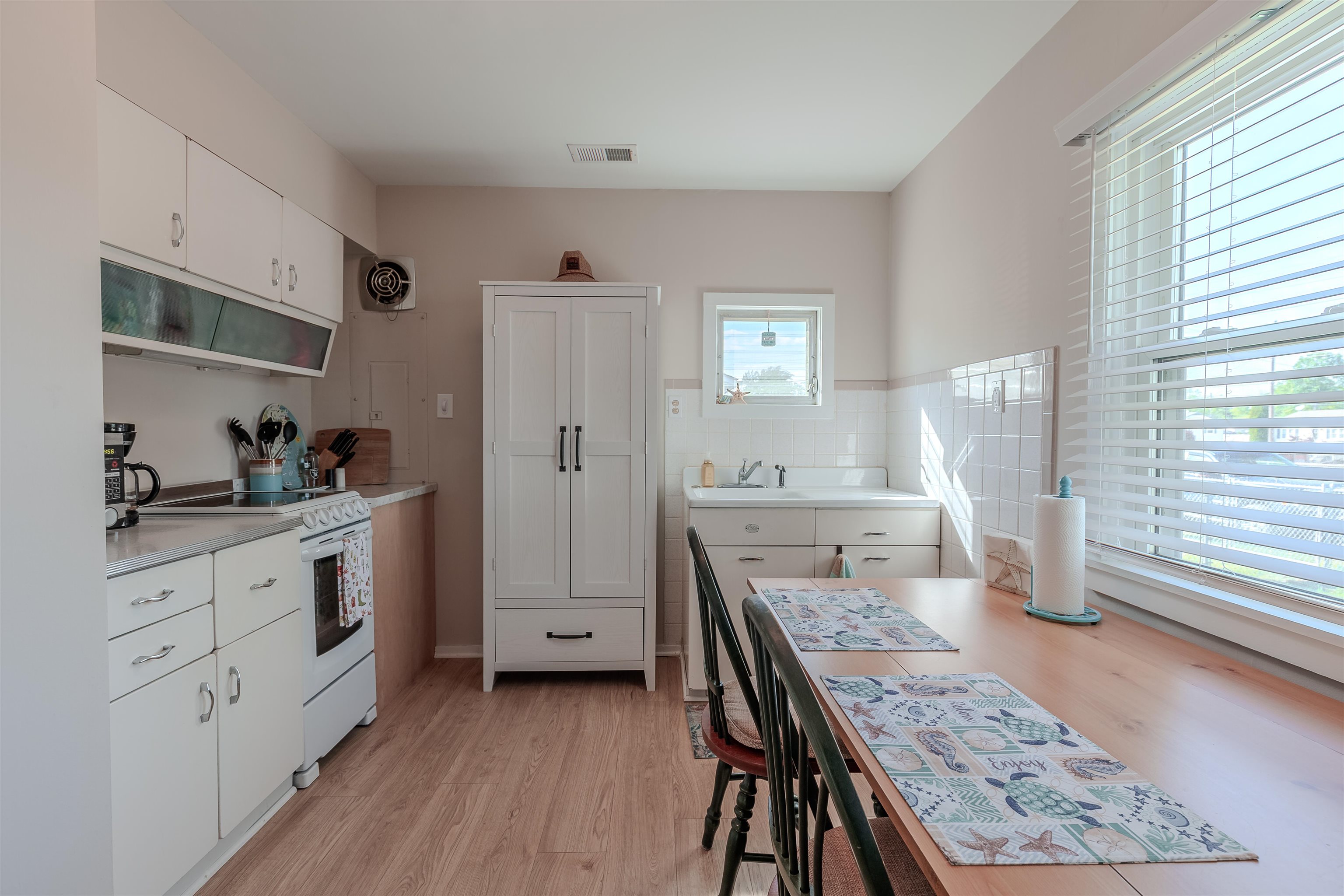34 Holiday Road Villas, NJ 08251 - Photo 10 of 44 a kitchen with stainless steel appliances granite countertop a stove top oven a sink dishwasher and cabinets with wooden floor