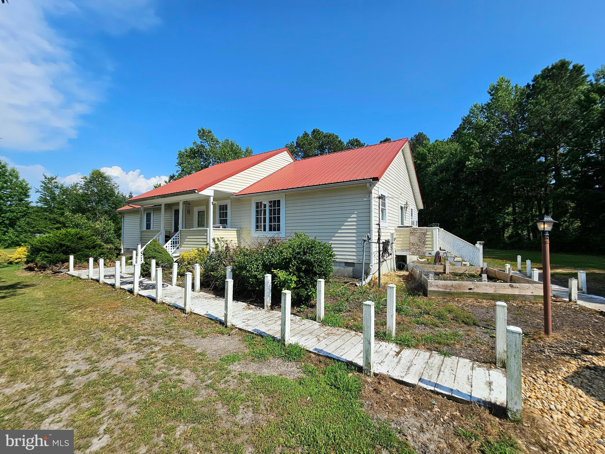8909 Arden Station Road Westover, MD 21871 - Photo 25 of 32 a front view of a house with a yard