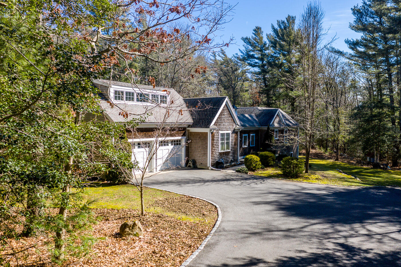 125 Woodside Road West Barnstable, MA 02668 - Photo 1 of 58 a front view of a house with swimming pool