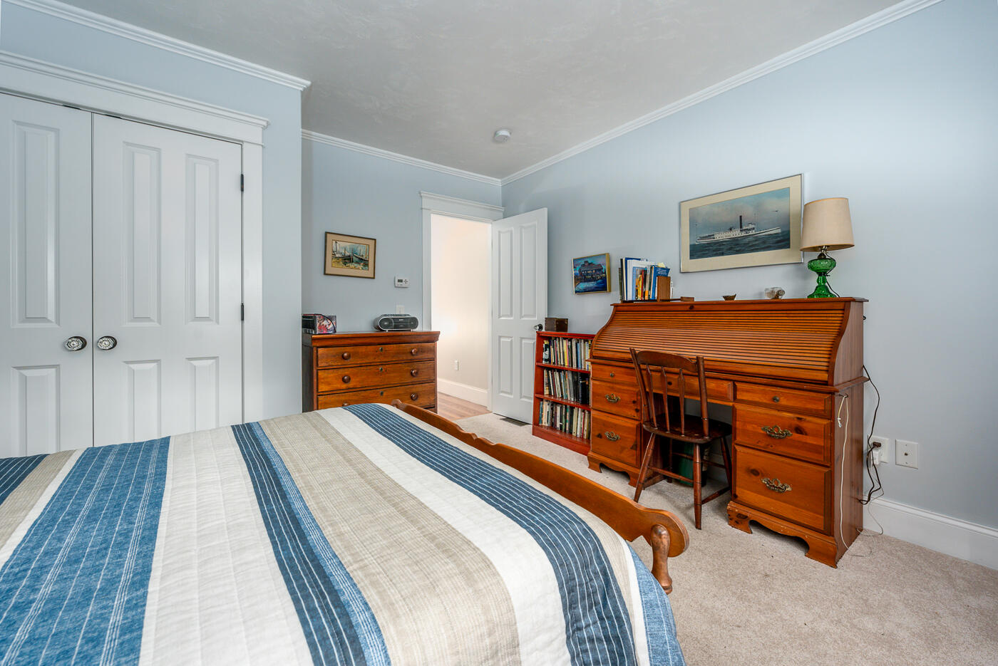 125 Woodside Road West Barnstable, MA 02668 - Photo 33 of 58 a bedroom with a bed and a chandelier