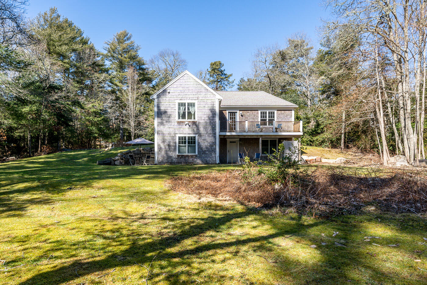 125 Woodside Road West Barnstable, MA 02668 - Photo 41 of 58 a view of a house with a yard and swimming pool