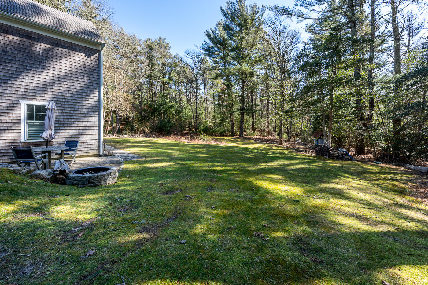 125 Woodside Road West Barnstable, MA 02668 - Photo 44 of 58 a view of a house with a big yard and large trees