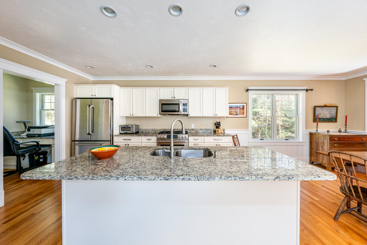 125 Woodside Road West Barnstable, MA 02668 - Photo 10 of 58 a kitchen with refrigerator stove dining table and chairs