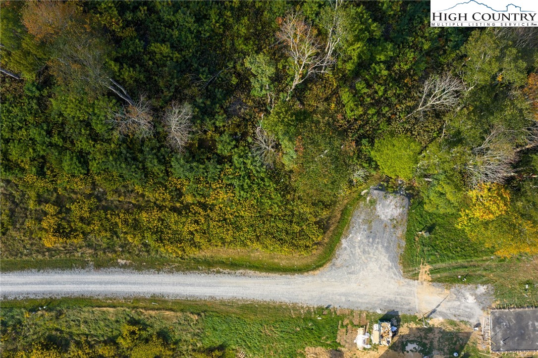 146 Banner Road Southwest Banner Elk, NC 28604 - Photo 10 of 22 a view of a lake with a yard