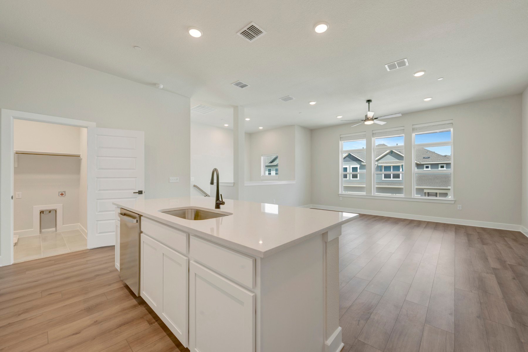 1017 Brickell Loop Austin, TX 78744 - Photo 11 of 31 Kitchen Island - Utility Room - Family Room