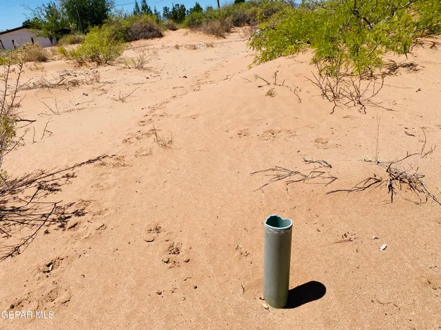 a view of roof covered with snow in the background