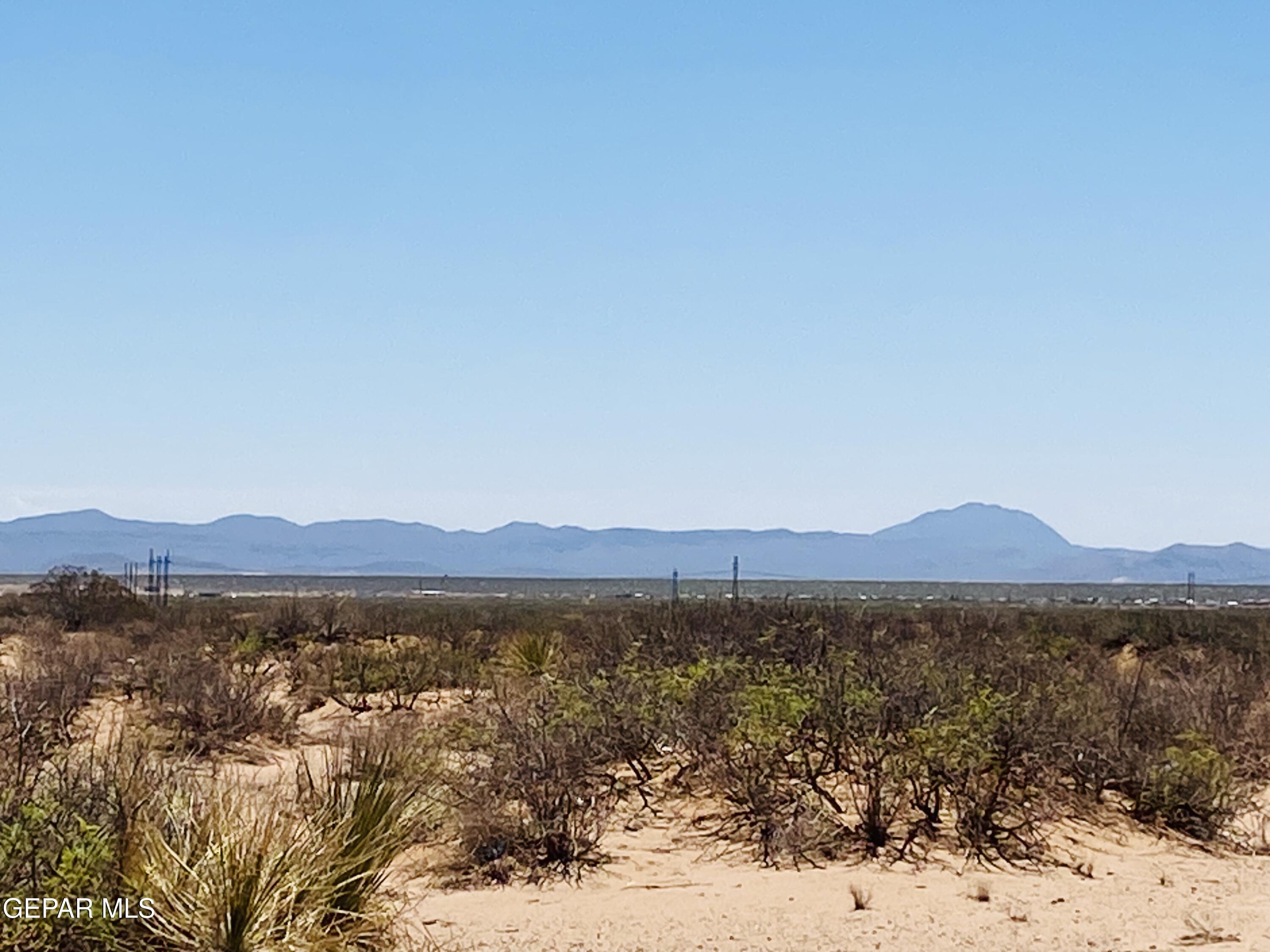 709 Rosencrans Street Chaparral, NM 88081 - Photo 6 of 10 a view of a large body of water with lots of trees in the background