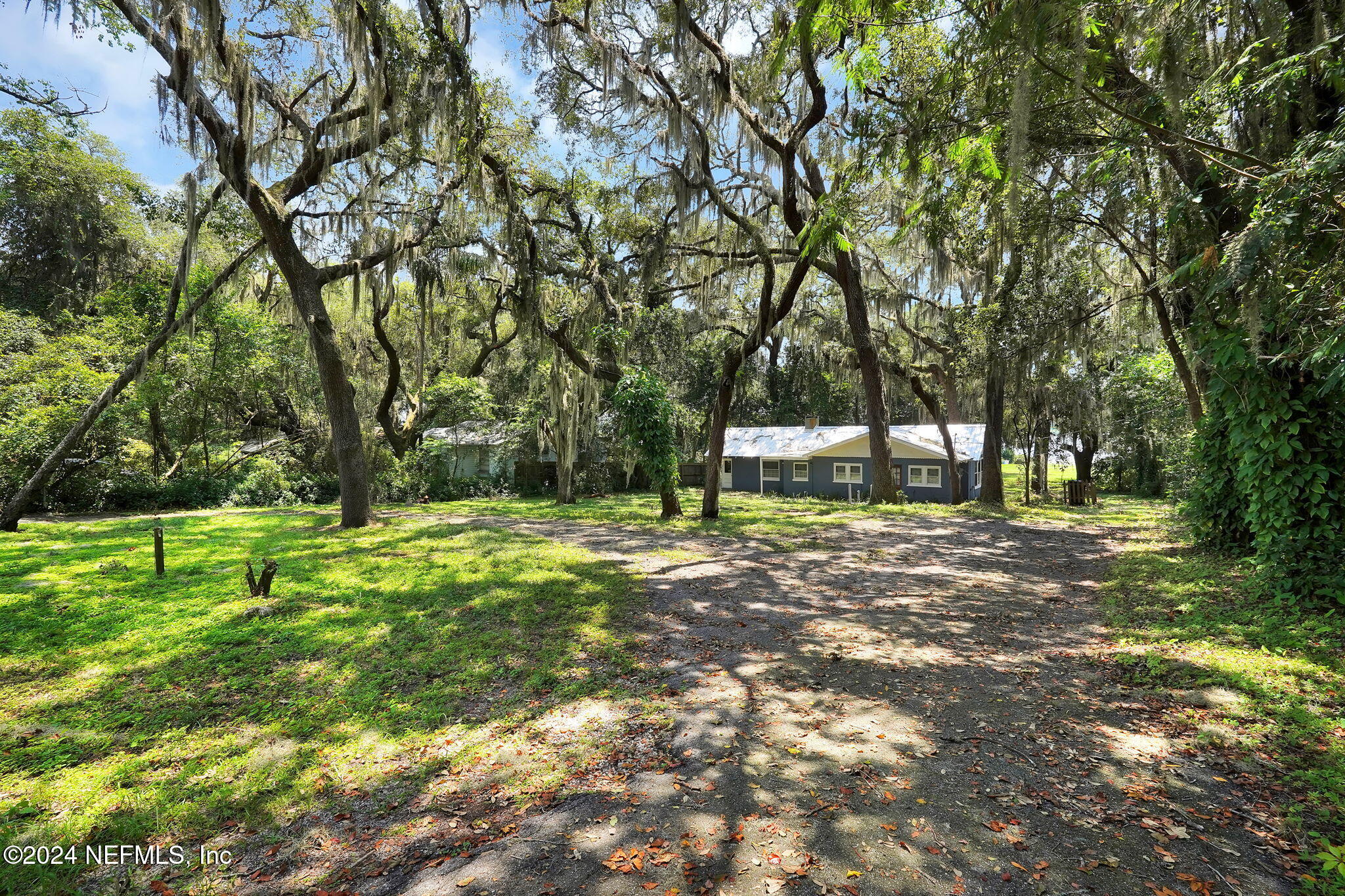 25 Forest Street Keystone Heights, FL 32656 - Photo 1 of 22 a view of outdoor space with deck and trees