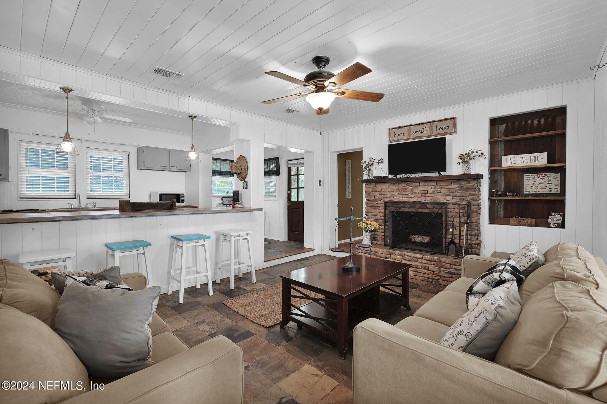 25 Forest Street Keystone Heights, FL 32656 - Photo 13 of 22 a living room with furniture and a fireplace