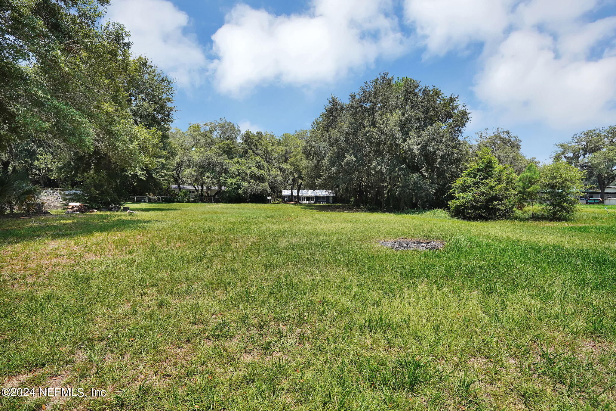 25 Forest Street Keystone Heights, FL 32656 - Photo 20 of 22 a view of a field with a trees in the background