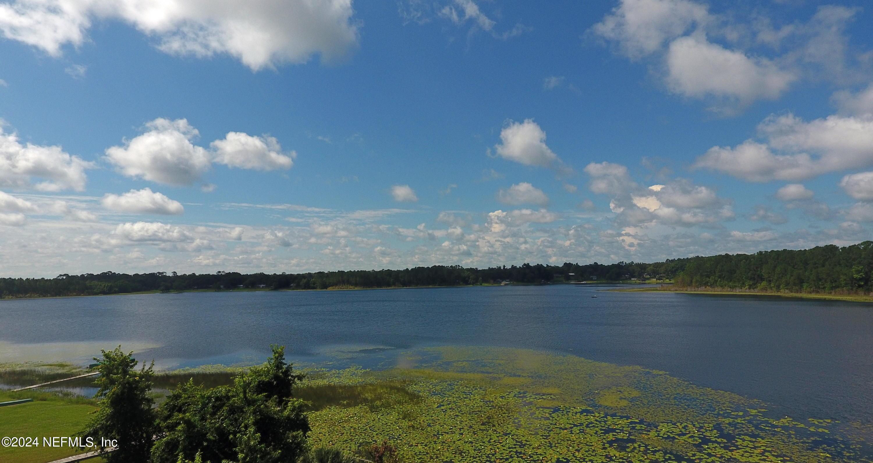 25 Forest Street Keystone Heights, FL 32656 - Photo 21 of 22 a view of a lake in middle of the house