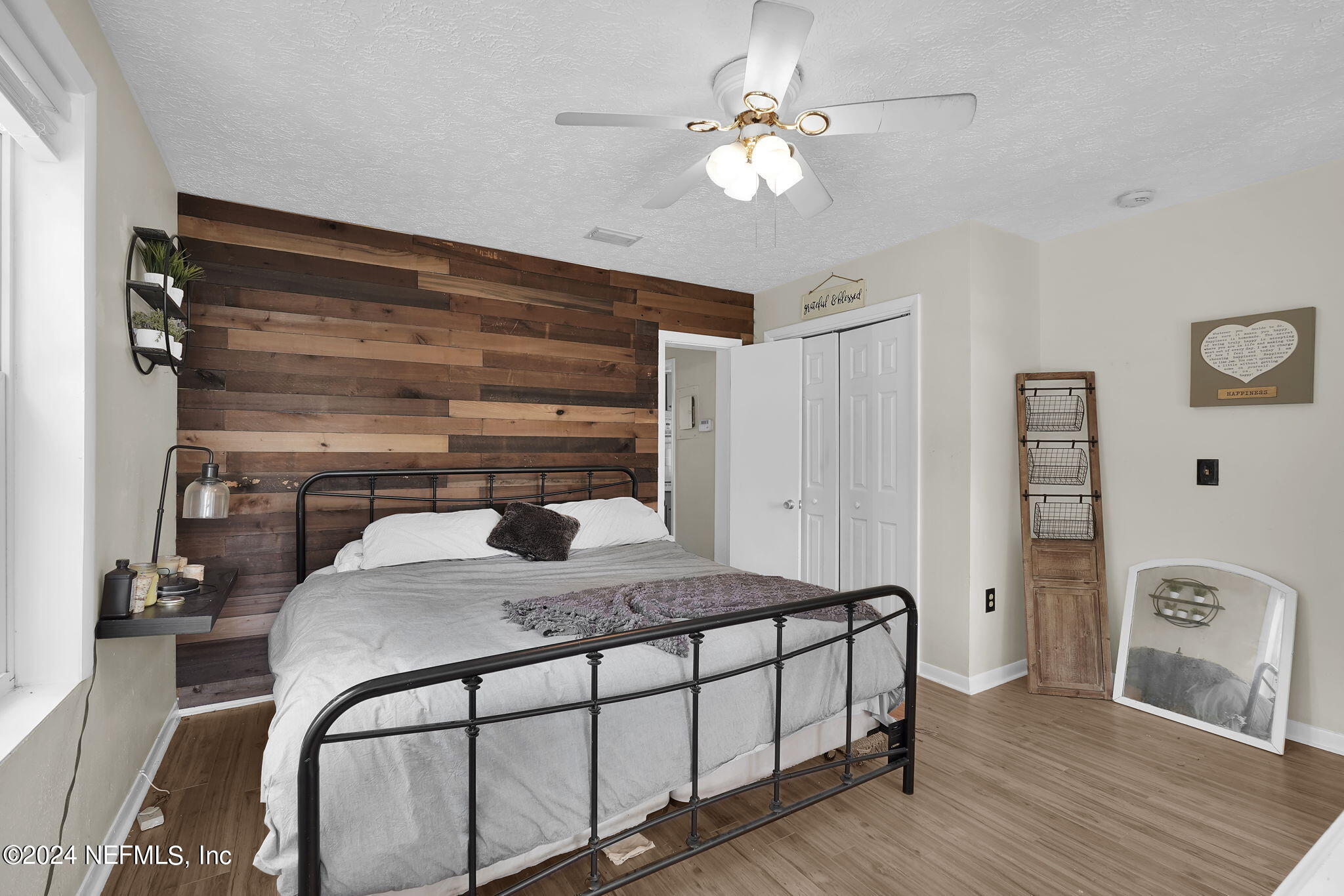 25 Forest Street Keystone Heights, FL 32656 - Photo 6 of 22 a bedroom with a bed a window and flowerpot
