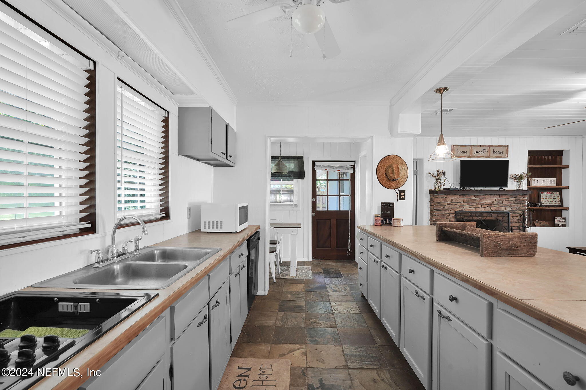25 Forest Street Keystone Heights, FL 32656 - Photo 7 of 22 a kitchen with stainless steel appliances a sink stove and microwave