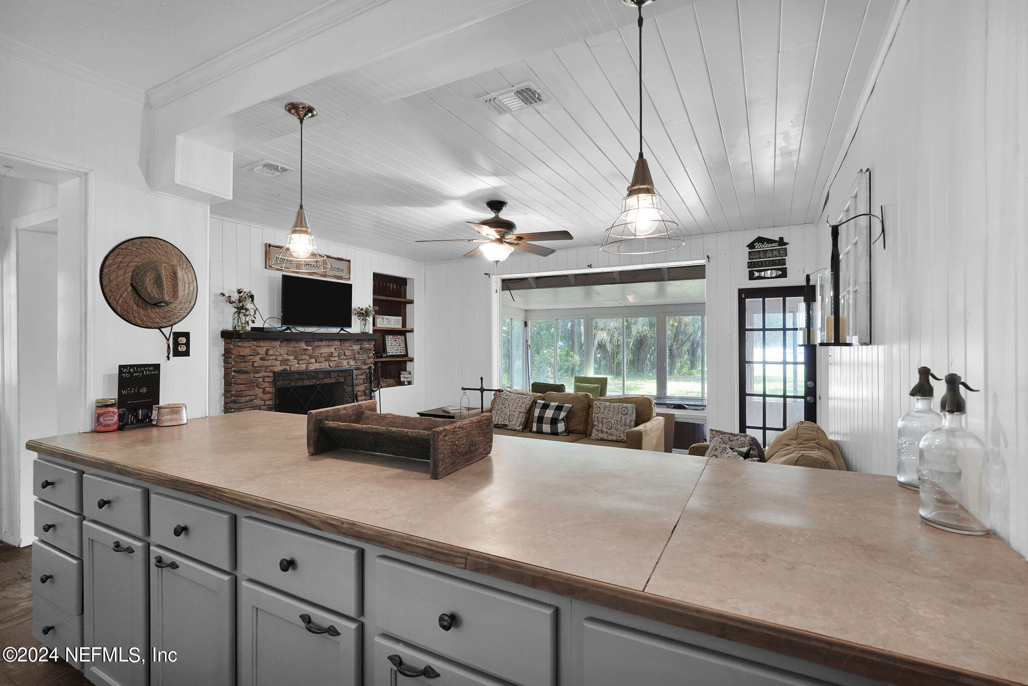 25 Forest Street Keystone Heights, FL 32656 - Photo 8 of 22 a kitchen with a counter space a sink and a window