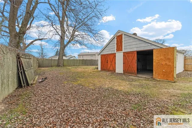 a backyard of a house with large trees