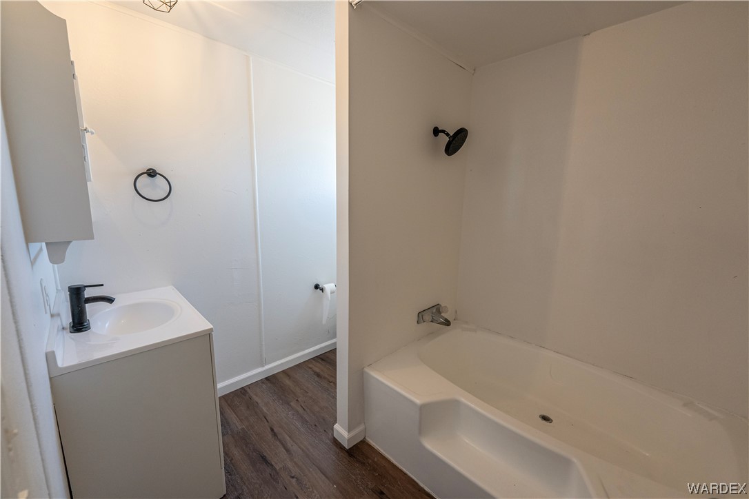 2337 South Canelo Road Golden Valley, AZ 86413 - Photo 11 of 30 a bathroom with a sink a bath tub and shower