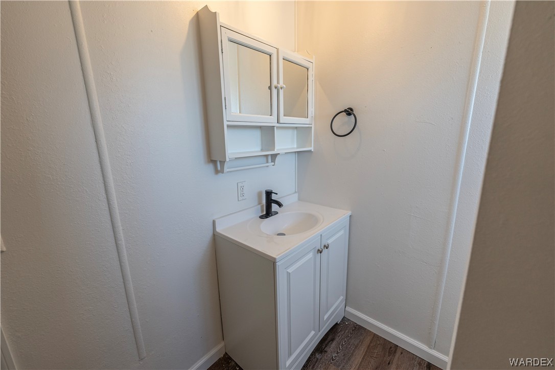2337 South Canelo Road Golden Valley, AZ 86413 - Photo 13 of 30 a bathroom with a sink and a mirror