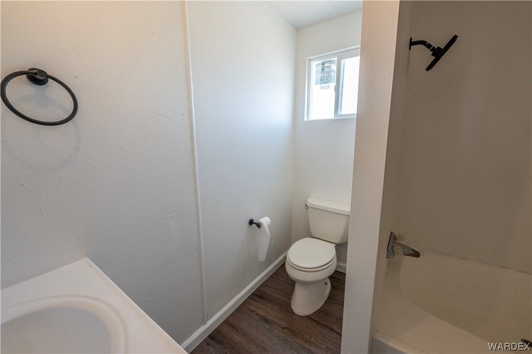 2337 South Canelo Road Golden Valley, AZ 86413 - Photo 17 of 30 a bathroom with a toilet and a sink
