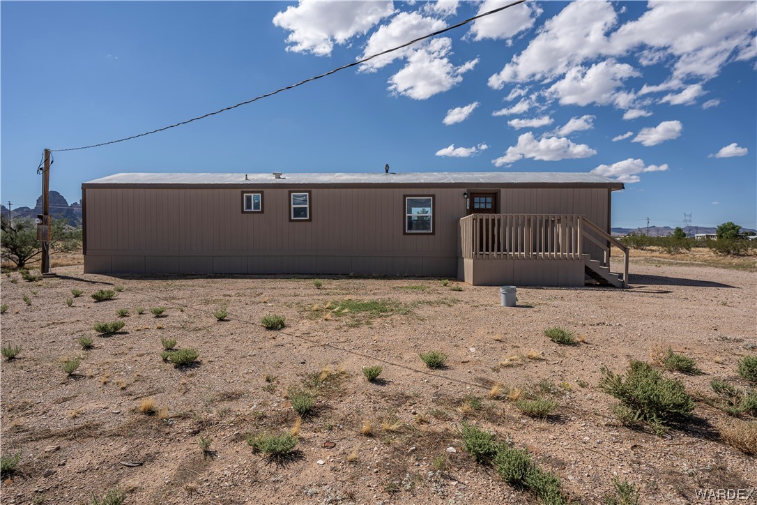 2337 South Canelo Road Golden Valley, AZ 86413 - Photo 18 of 30 a front view of a house with a yard