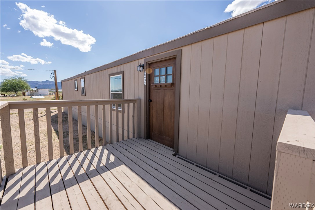 2337 South Canelo Road Golden Valley, AZ 86413 - Photo 2 of 30 a view of wooden balcony