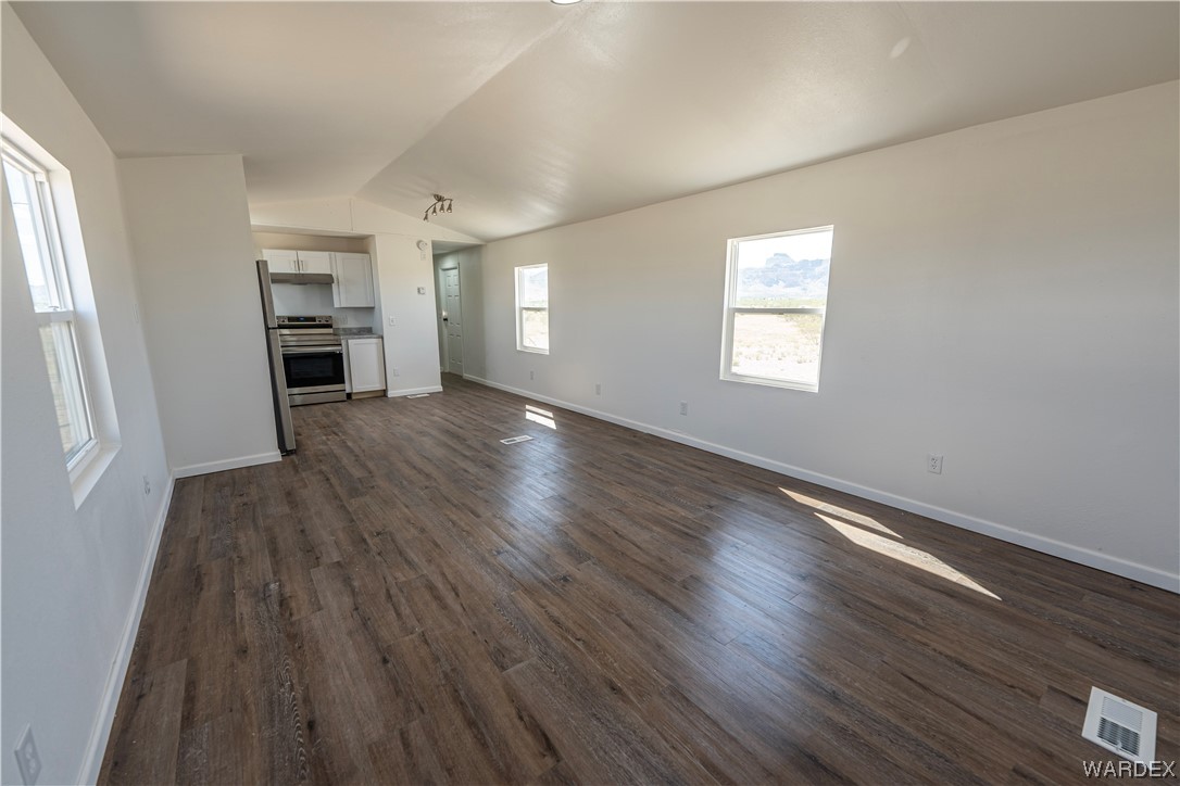 2337 South Canelo Road Golden Valley, AZ 86413 - Photo 21 of 30 an empty room with wooden floor closet and windows