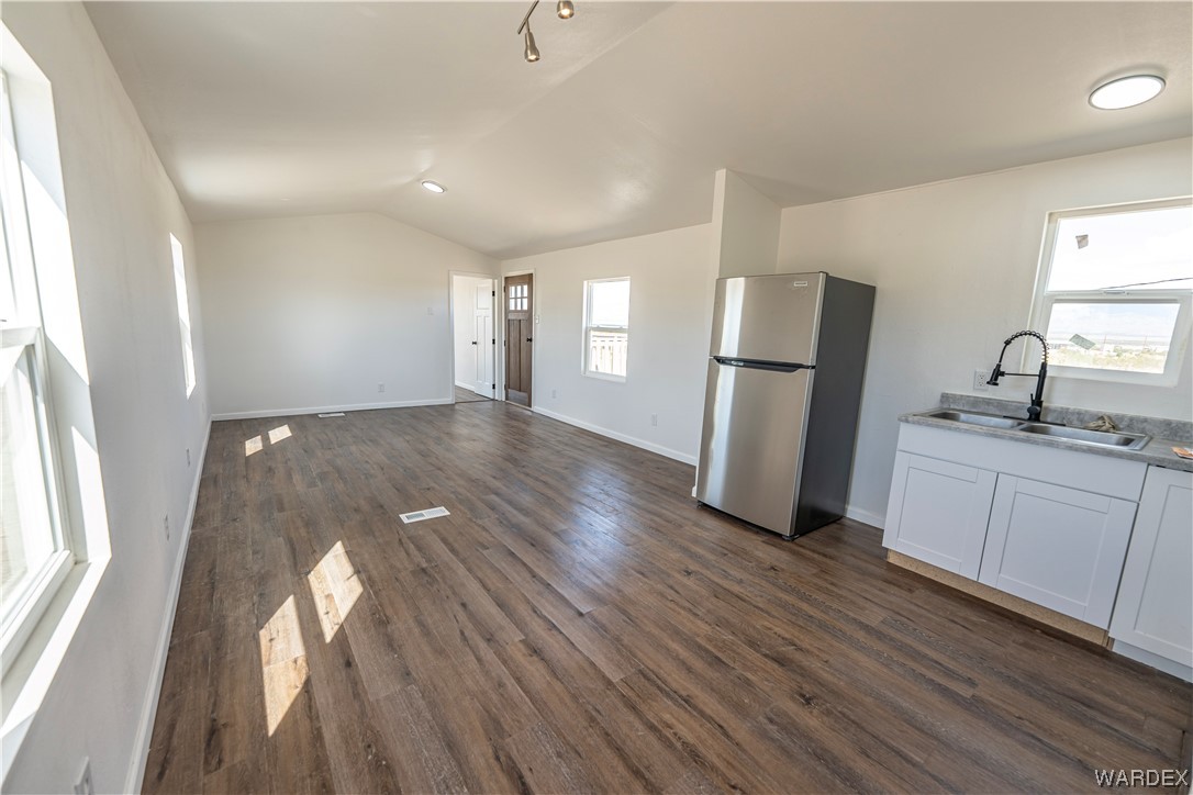 2337 South Canelo Road Golden Valley, AZ 86413 - Photo 6 of 30 a kitchen with sink and refrigerator