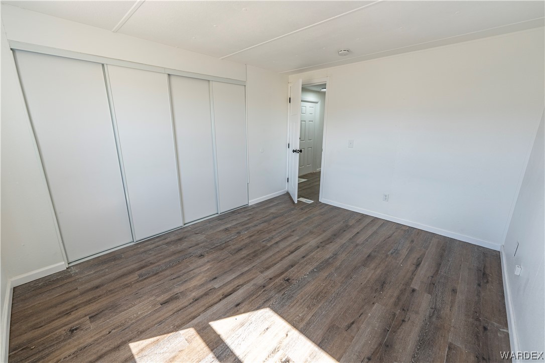 2337 South Canelo Road Golden Valley, AZ 86413 - Photo 10 of 30 a view of empty room with wooden floor