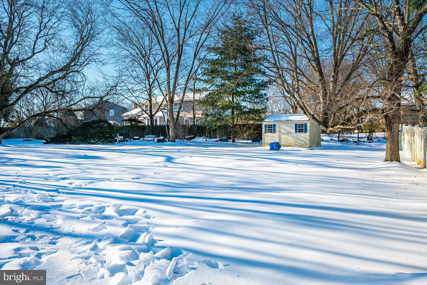 221 Hickory Corner Road East Windsor, NJ 08520 - Photo 26 of 29 Winter's serene blanket over a quiet yard.