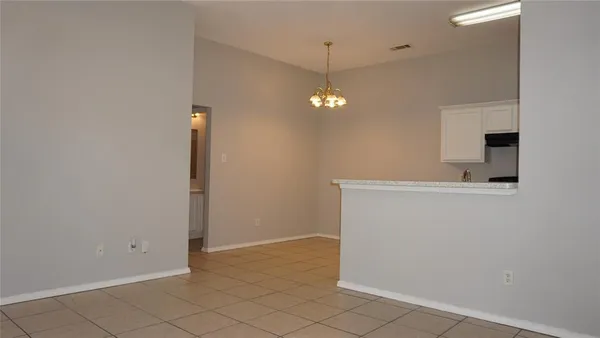 an empty room with a bathroom