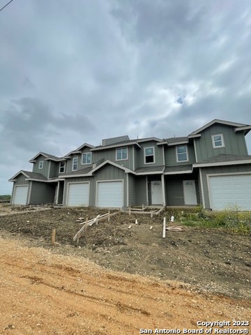 a front view of a house with garage