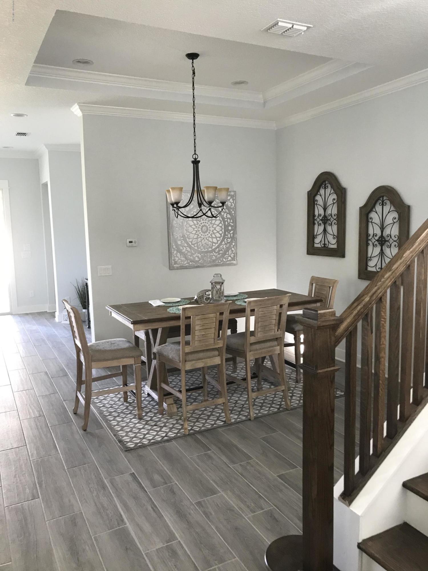 1709 Riley Street Jacksonville Beach, FL 32250 - Photo 12 of 42 a dining room with furniture and wooden floor