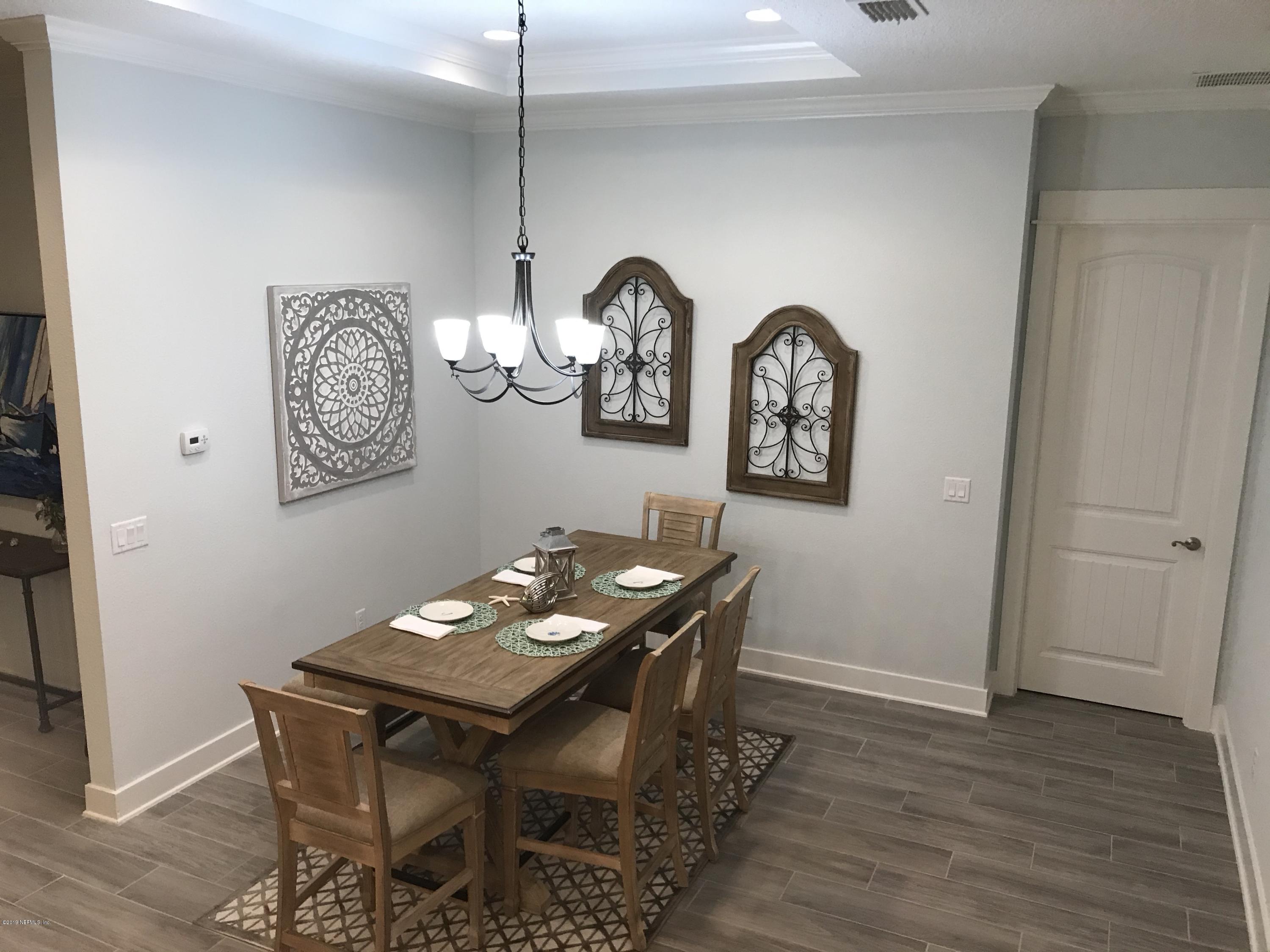 1709 Riley Street Jacksonville Beach, FL 32250 - Photo 13 of 42 a view of a dining room with furniture and wooden floor