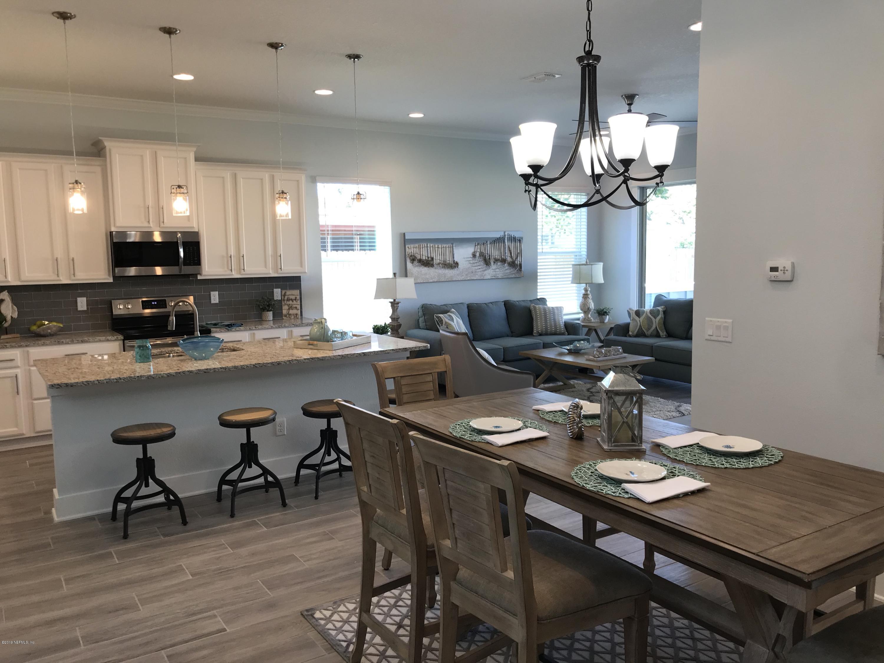 1709 Riley Street Jacksonville Beach, FL 32250 - Photo 14 of 42 a dining room filled chandelier and kitchen view