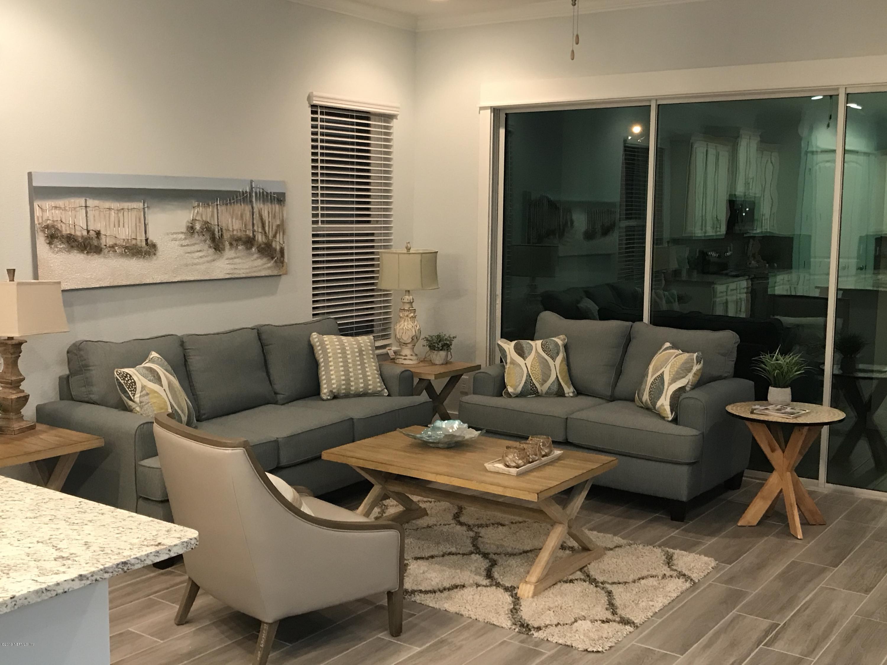 1709 Riley Street Jacksonville Beach, FL 32250 - Photo 16 of 42 a living room with furniture and a large window