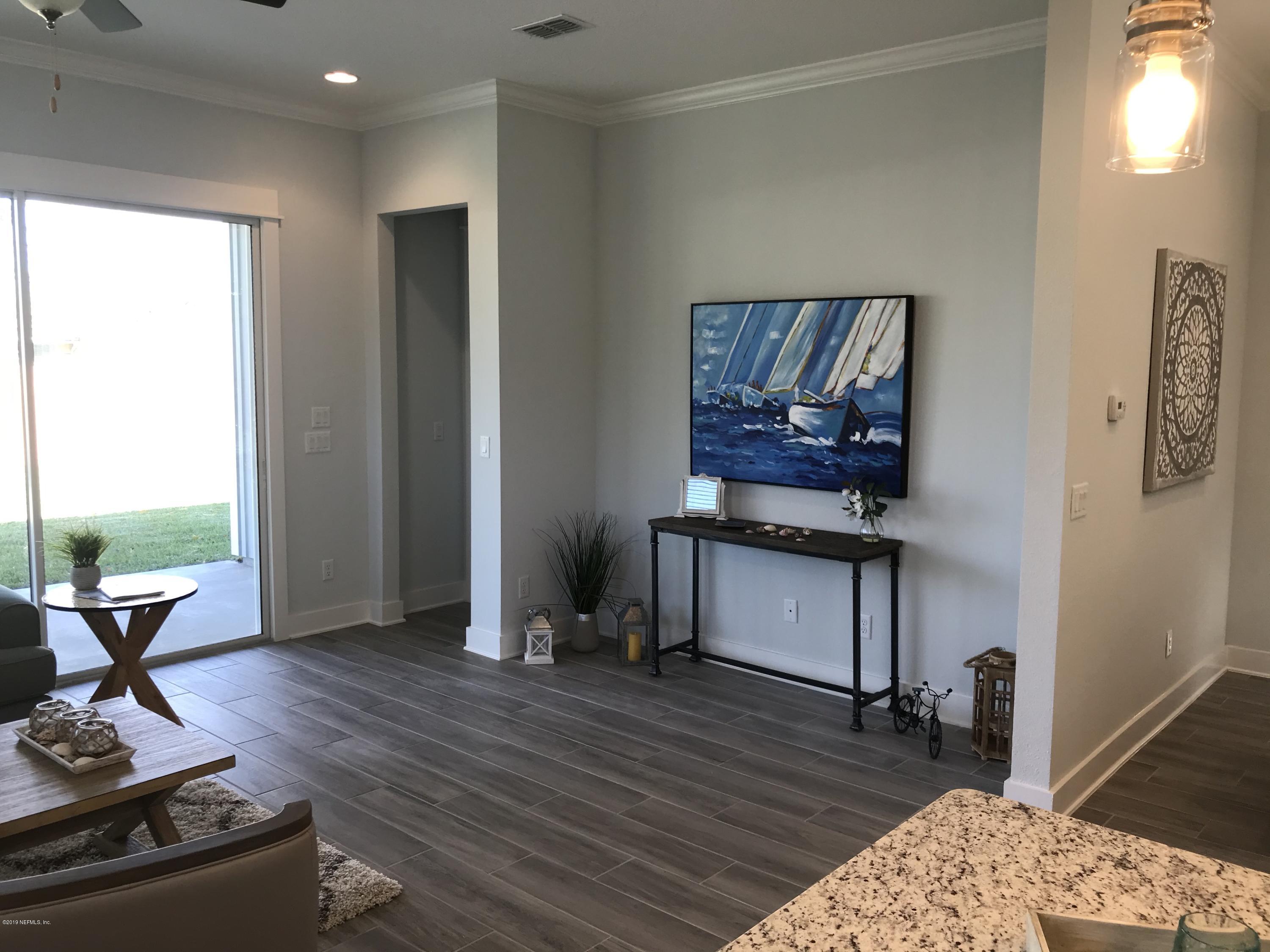 1709 Riley Street Jacksonville Beach, FL 32250 - Photo 17 of 42 a living room with furniture and a wooden floor