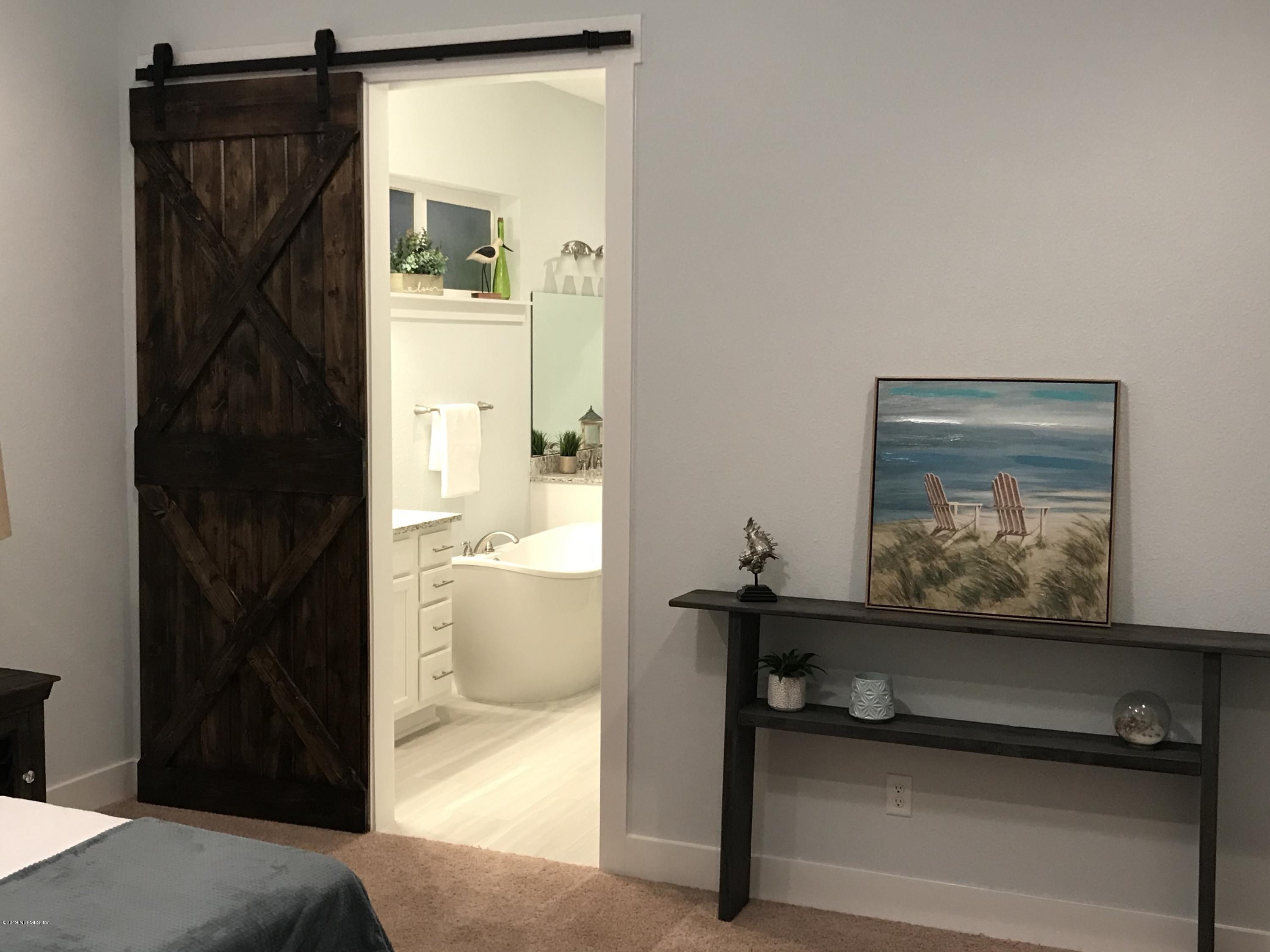 1709 Riley Street Jacksonville Beach, FL 32250 - Photo 19 of 42 a view of a hallway with a living room