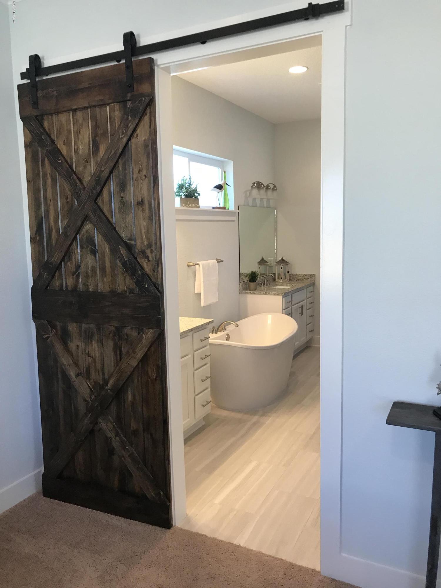 1709 Riley Street Jacksonville Beach, FL 32250 - Photo 20 of 42 a view of a bathtub & sink in a bathroom