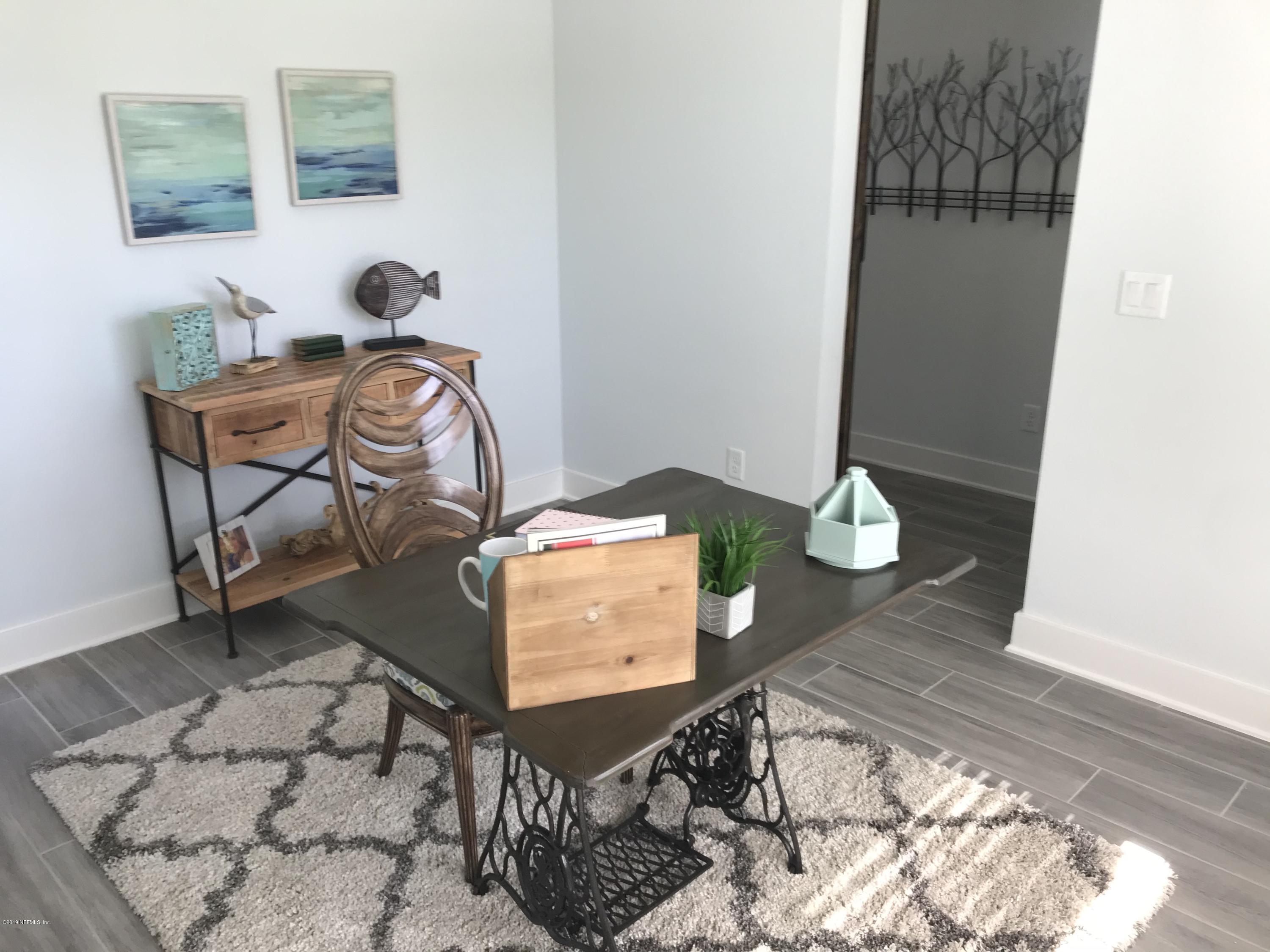 1709 Riley Street Jacksonville Beach, FL 32250 - Photo 26 of 42 a living room with furniture and a gate